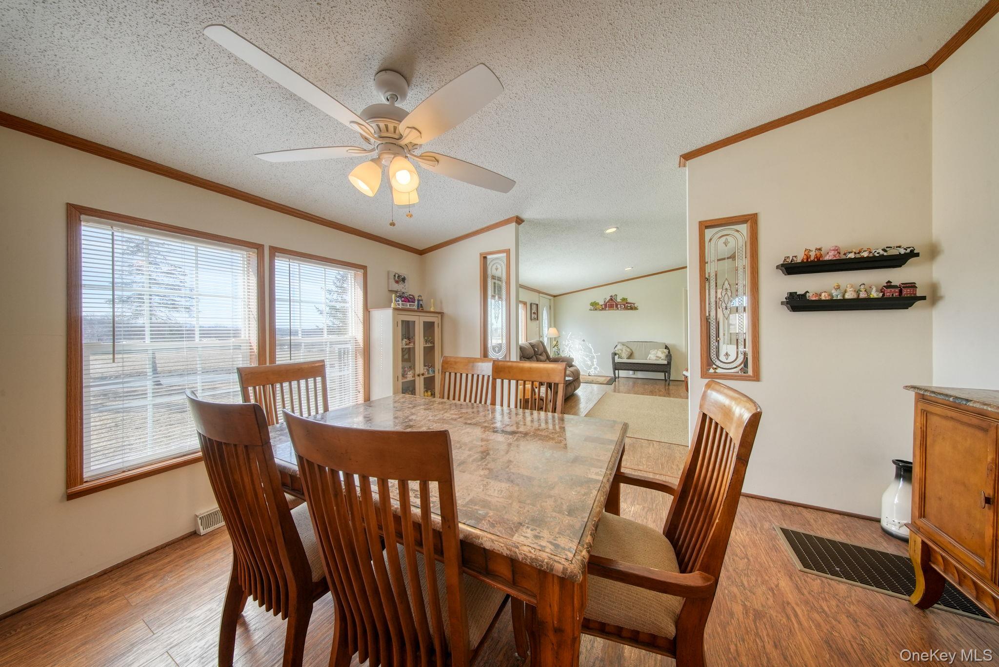 221 Gabel Road Callicoon, NY 12723 - Photo 20 of 44 a view of a dining room with furniture window and wooden floor