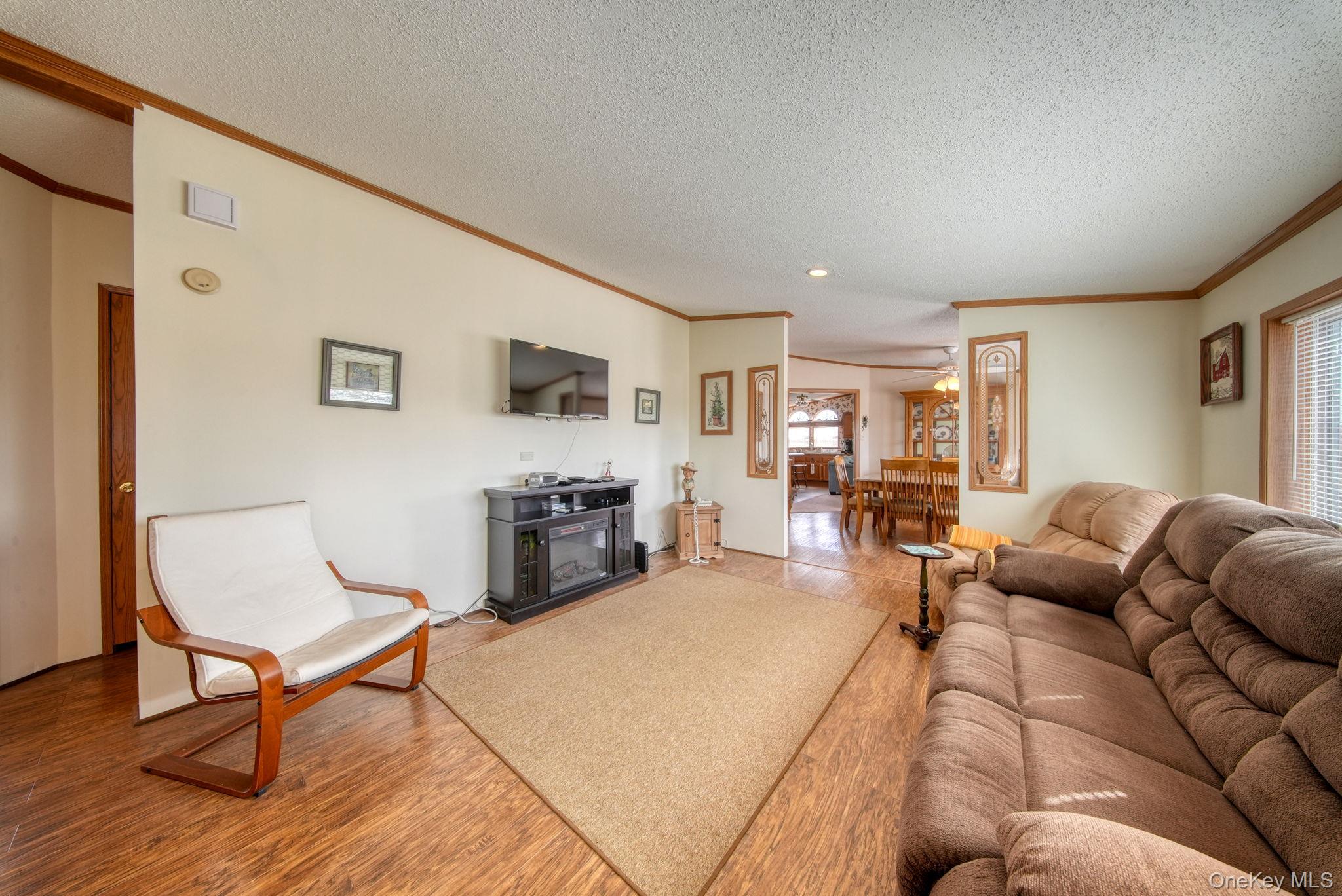 221 Gabel Road Callicoon, NY 12723 - Photo 26 of 44 a living room with furniture wooden floor and a flat screen tv
