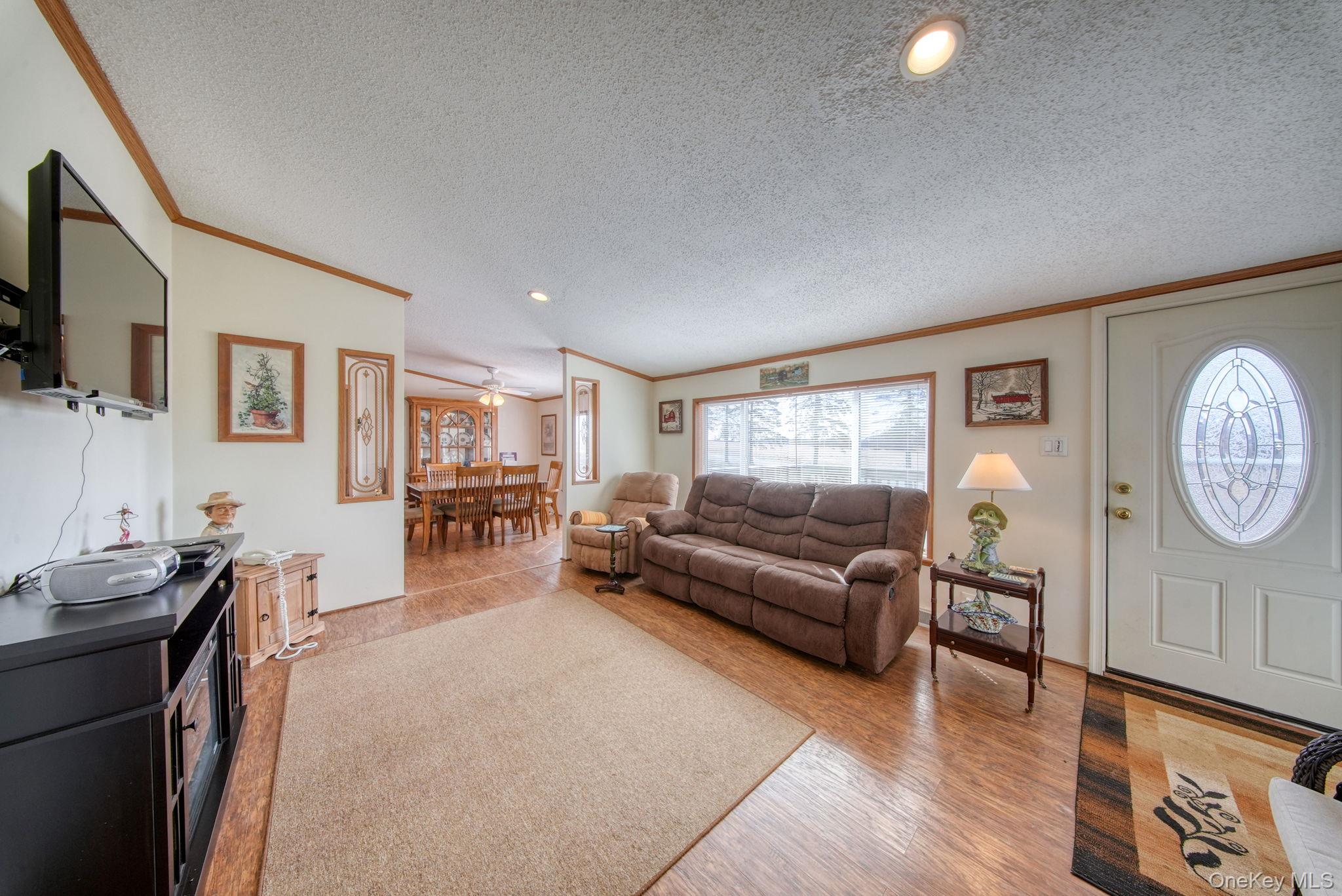 221 Gabel Road Callicoon, NY 12723 - Photo 27 of 44 a living room with furniture and a flat screen tv
