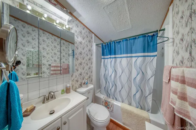 a bedroom with a bed couch and window