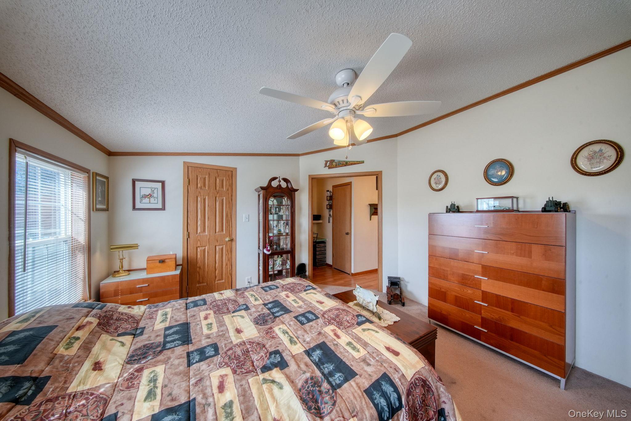 221 Gabel Road Callicoon, NY 12723 - Photo 33 of 44 a bedroom with a bed and dresser with mirror