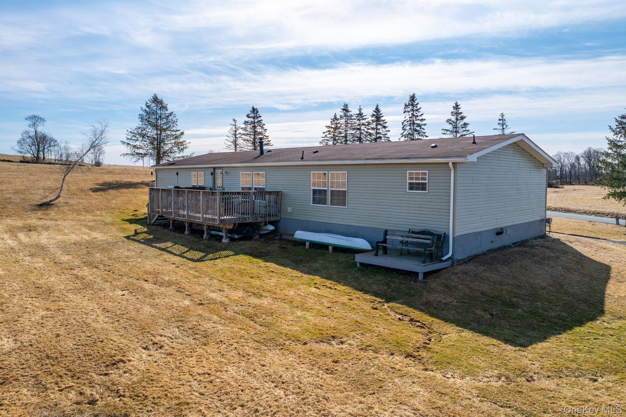 221 Gabel Road Callicoon, NY 12723 - Photo 41 of 44 a view of a house with a yard in the back