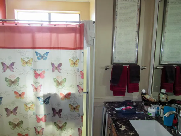 a bathroom with a bathtub and shower