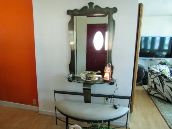 a view of hall way with furniture