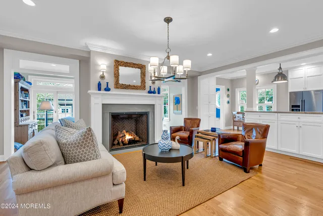 a large kitchen with stainless steel appliances granite countertop a stove and a sink