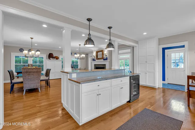 a living room with furniture ceiling fan and a window