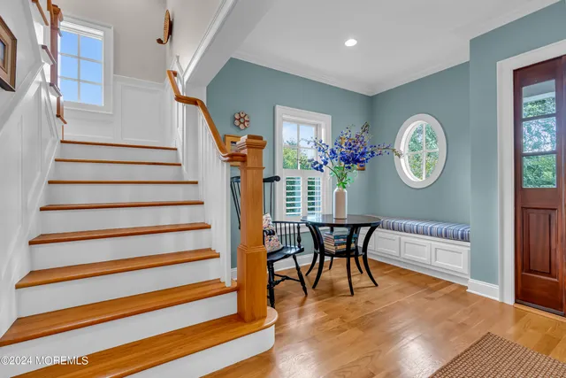 a spacious bathroom with a granite countertop sink and a mirror