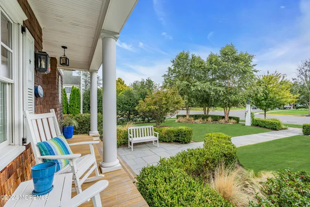 a view of yard from outdoor seating area