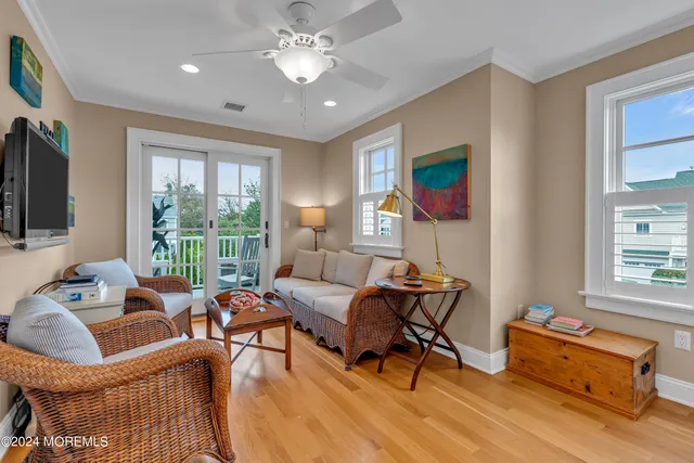 a view of a hallway view with wooden floor and bedroom