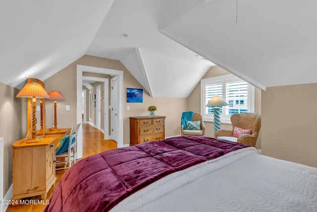 a view of a chairs and table in the back yard of the house