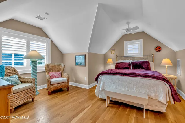 a view of a patio with a table and chairs under an umbrella