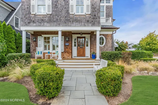a view of a livingroom with furniture and hardwood floor