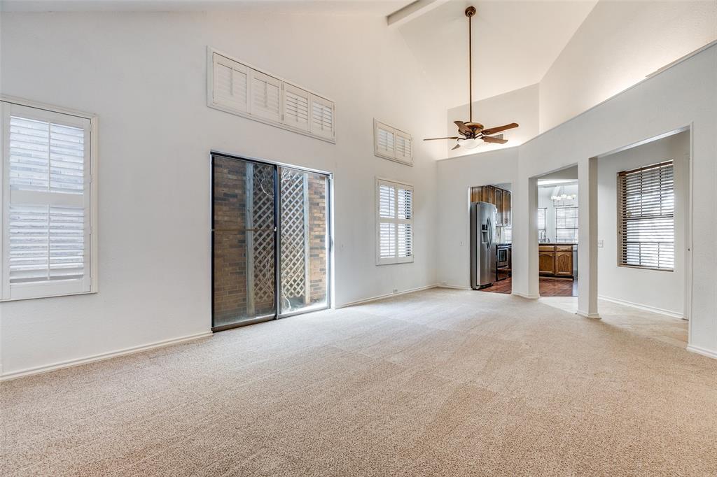 4147 Rosser Square Dallas, TX 75244 - Photo 4 of 11 a view of a livingroom with a chandelier fan and windows