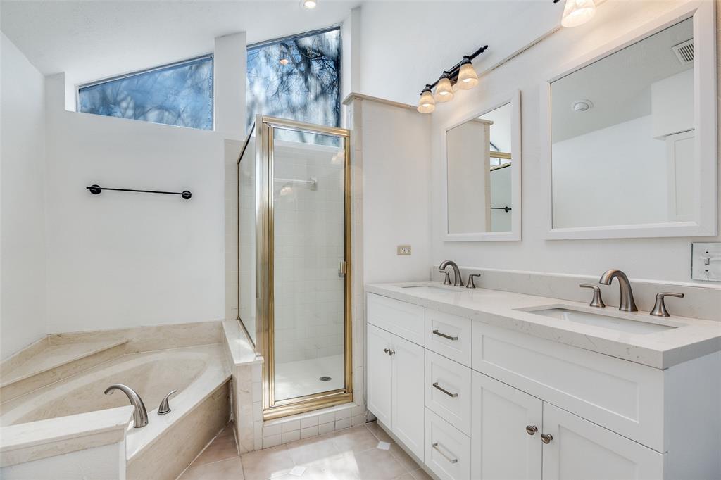 4147 Rosser Square Dallas, TX 75244 - Photo 9 of 11 a bathroom with a tub sink and mirror