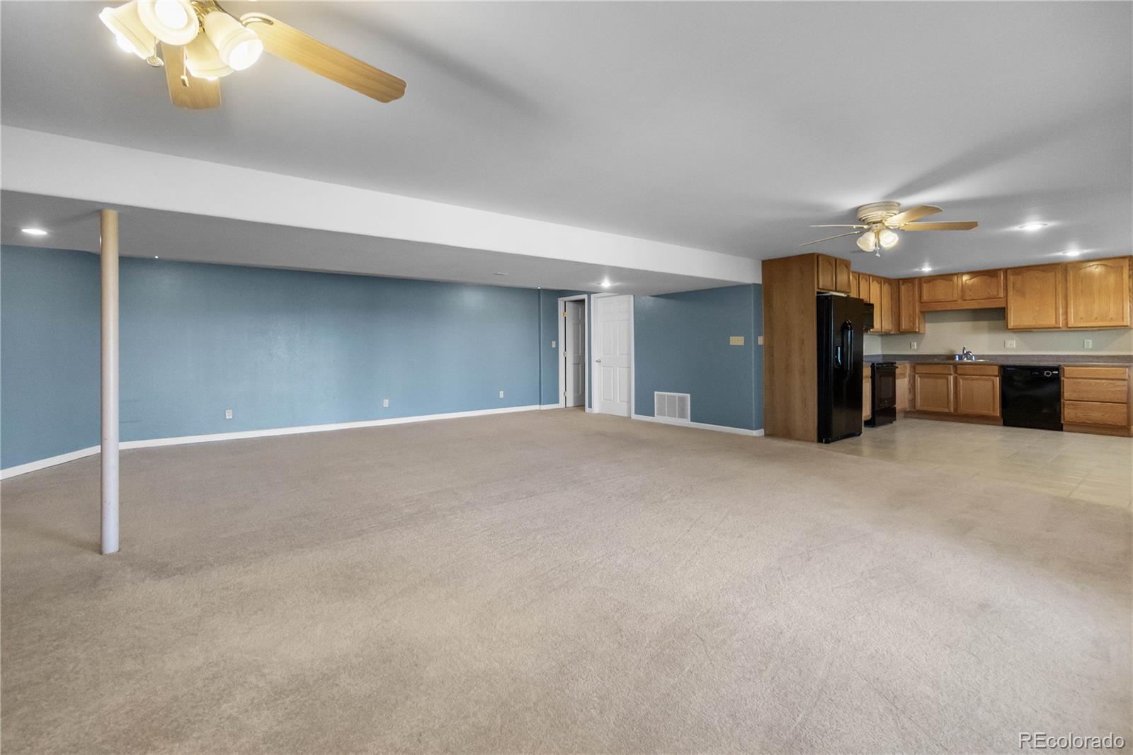 74 Rocky Cliff Road Elizabeth, CO 80107 - Photo 33 of 50 a view of a big room with a kitchen