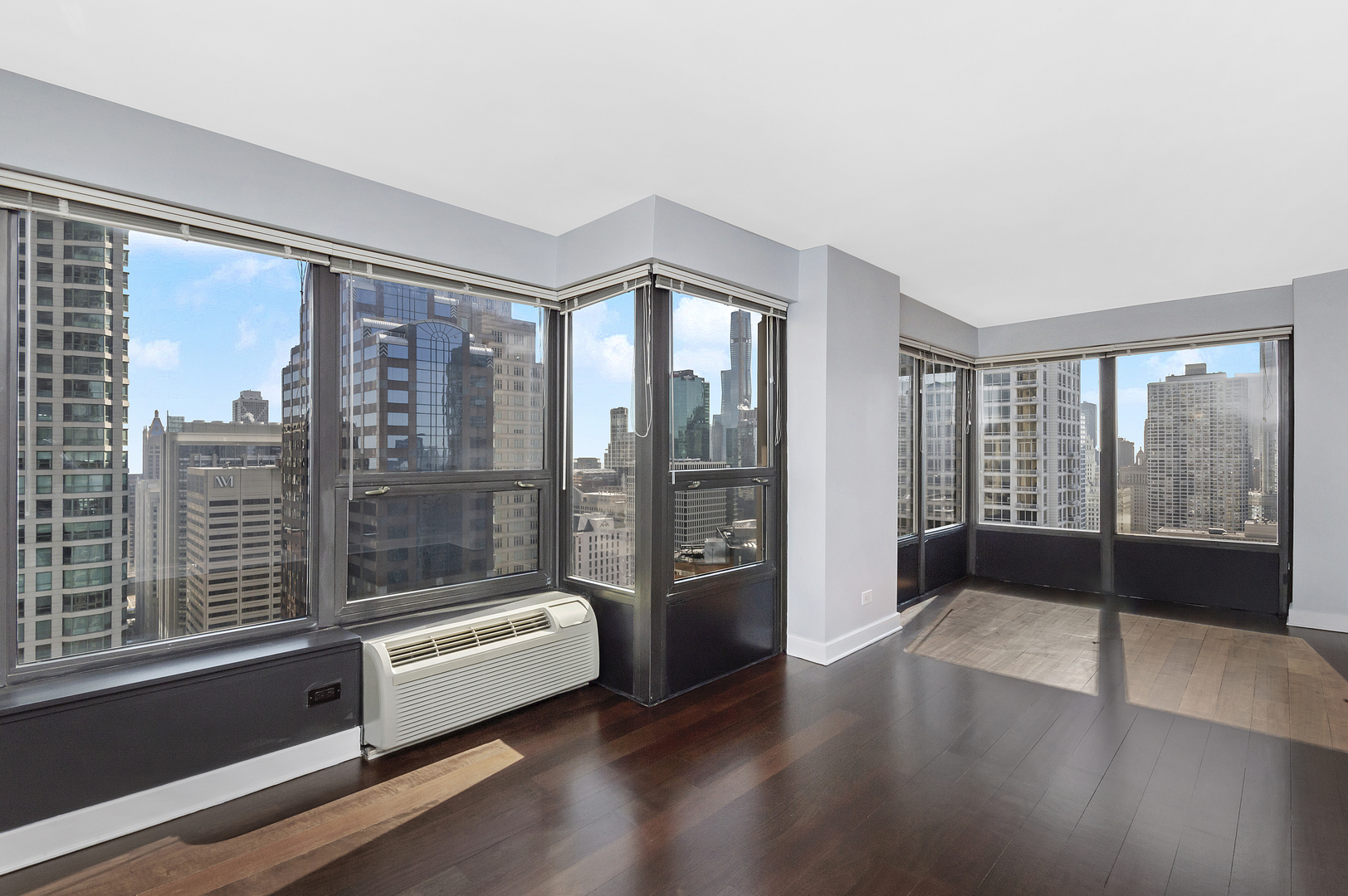 30 East Huron Street, Unit 3602 Chicago, IL 60611 - Photo 2 of 15 a large living room with a large window