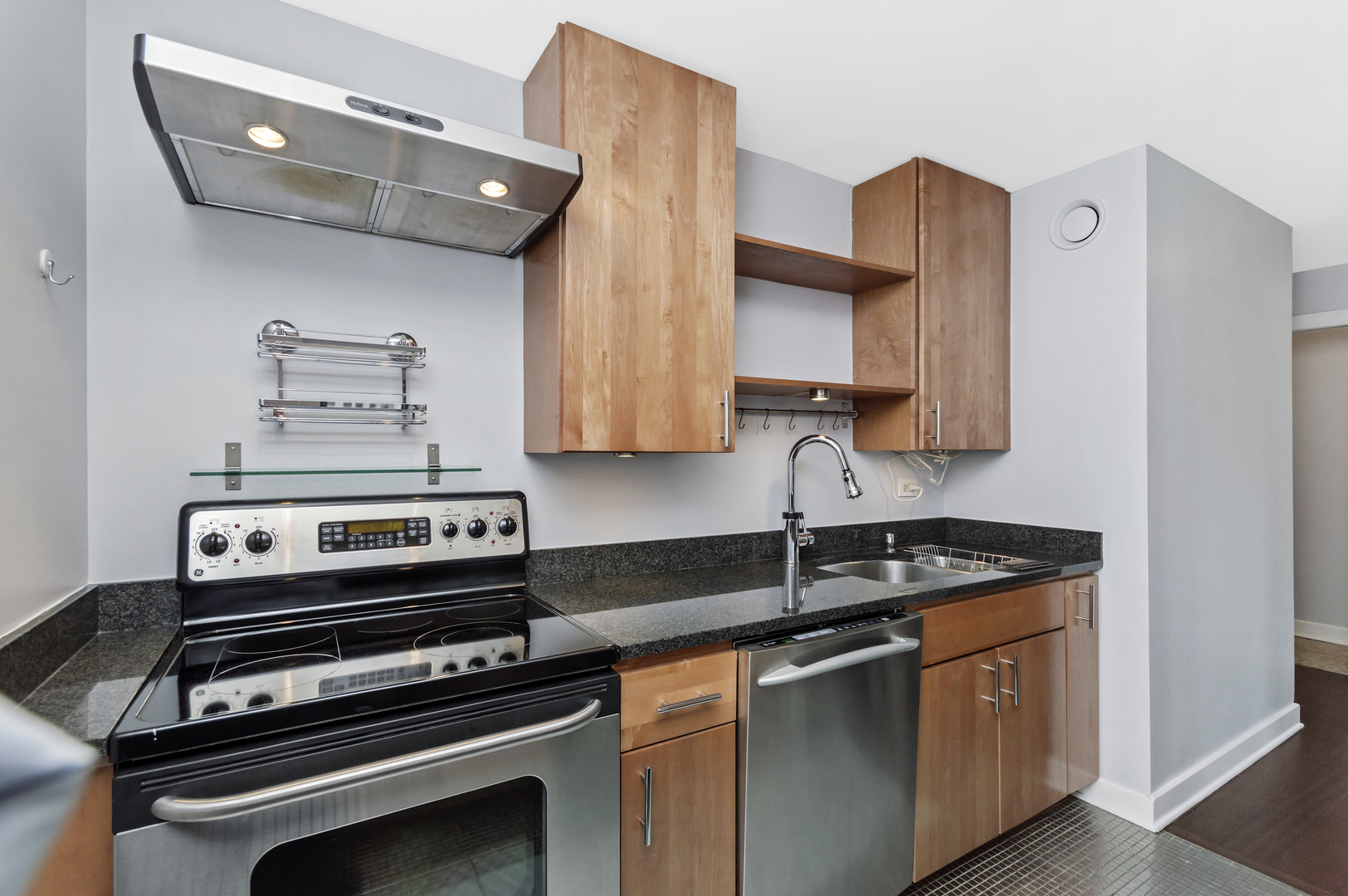 30 East Huron Street, Unit 3602 Chicago, IL 60611 - Photo 8 of 15 a kitchen with stainless steel appliances a stove a sink and cabinets