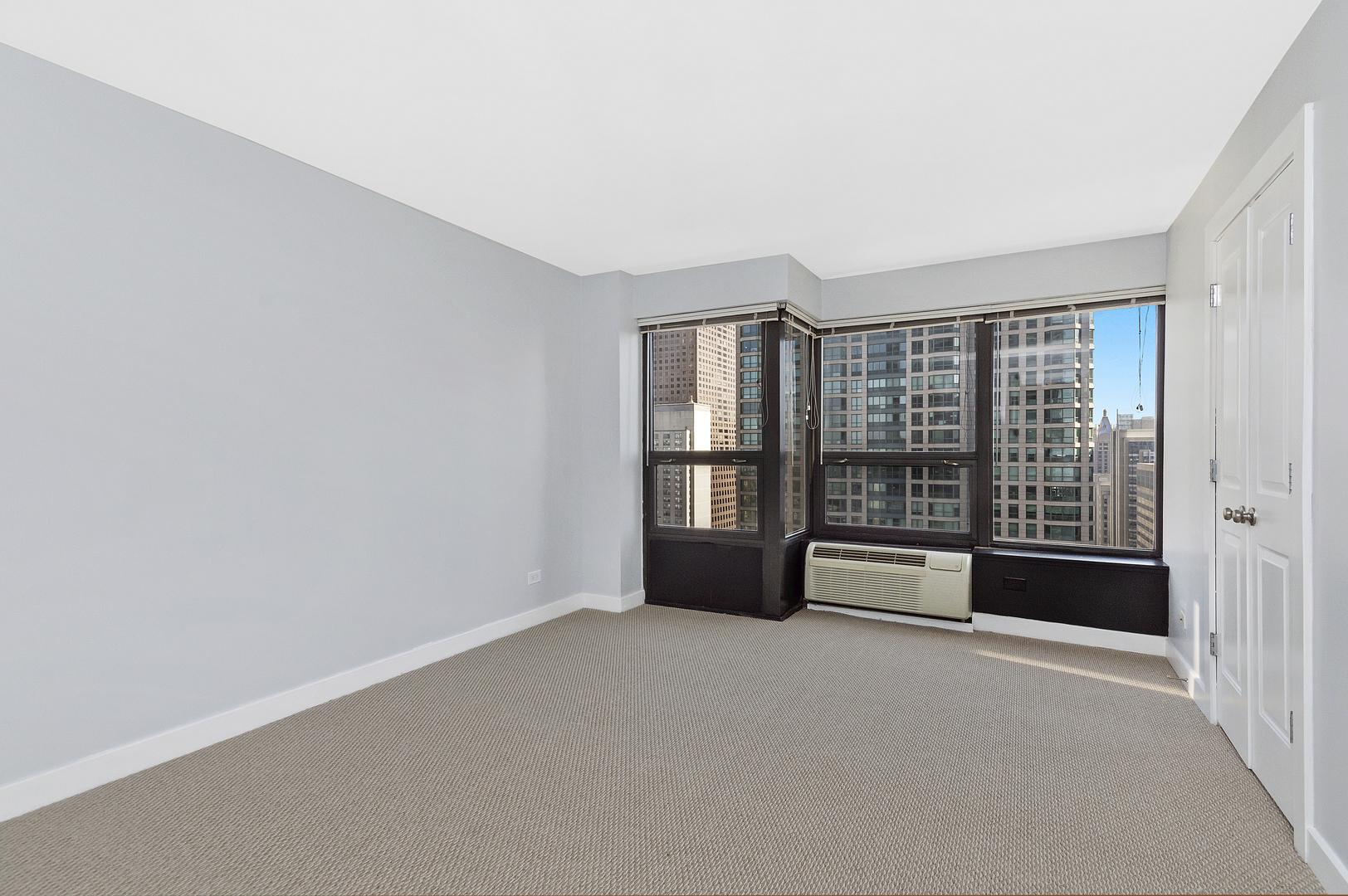 30 East Huron Street, Unit 3602 Chicago, IL 60611 - Photo 9 of 15 a view of an empty room with a window