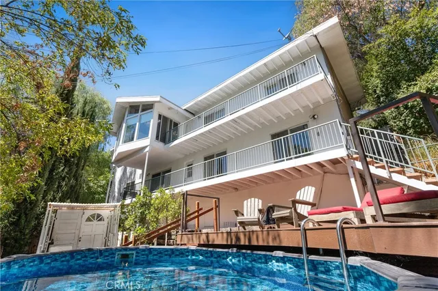 a view of house with outdoor space and seating