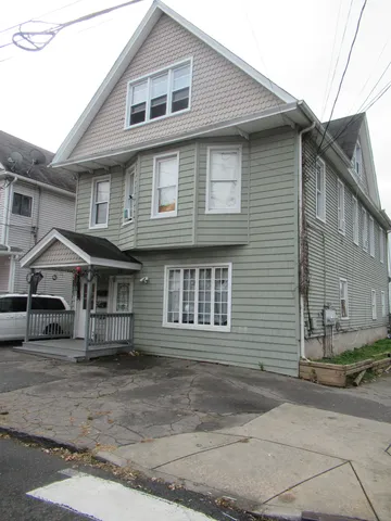 a front view of a house with garage