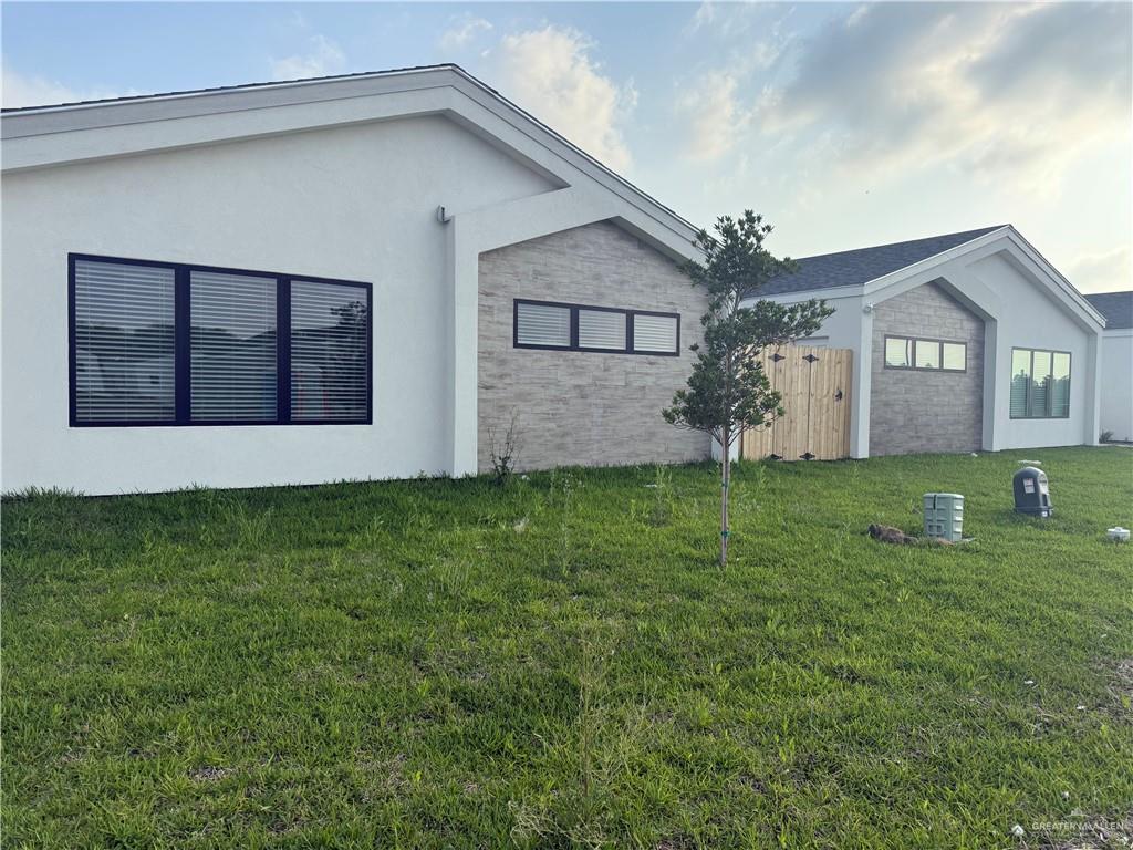 2701 Brownjay Road, Unit #3 Weslaco, TX 78596 - Photo 18 of 18 a front view of house with a garden