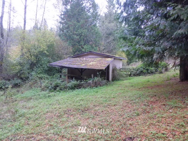 578 Brown Road East Chehalis, WA 98532 - Photo 6 of 16 a view of a barn in the middle of a forest