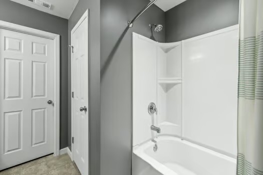 1470 Old Stone Road Lebanon, TN 37087 - Photo 13 of 23 a bathroom with a bathtub and a shower