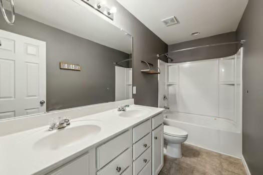 1470 Old Stone Road Lebanon, TN 37087 - Photo 20 of 23 a bathroom with a sink toilet double vanity and shower
