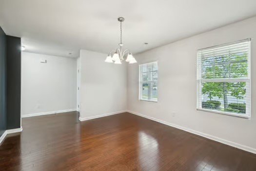 1470 Old Stone Road Lebanon, TN 37087 - Photo 5 of 23 a view of a room with wooden floor chandelier and windows