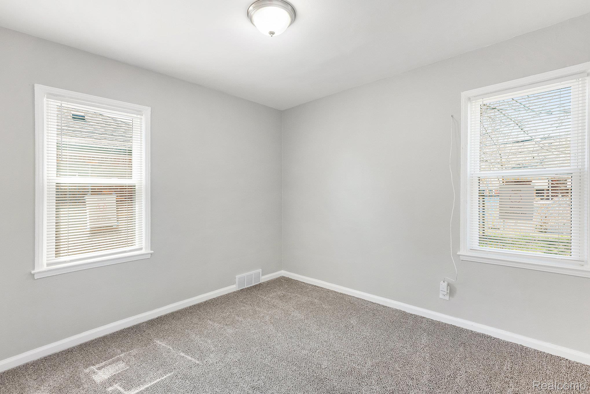 19315 Annchester Road Detroit, MI 48219 - Photo 9 of 17 Spare room with baseboards and light carpet