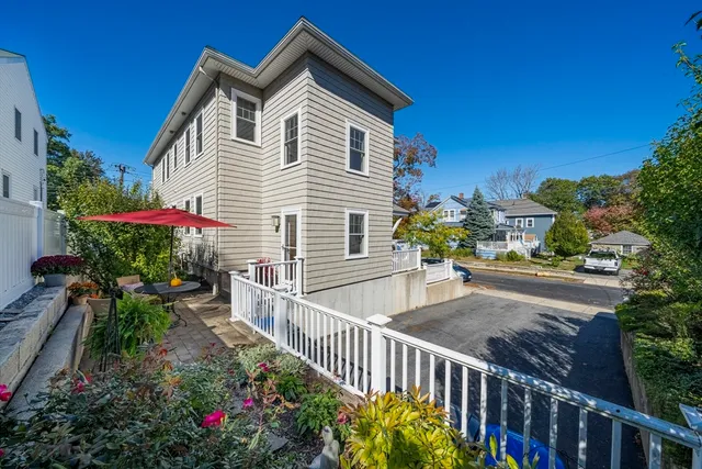 a view of a house with wooden fence