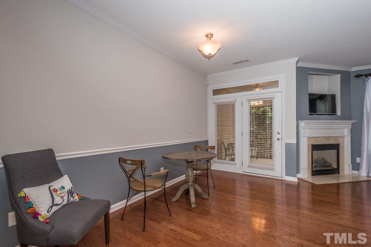 4924 Amber Clay Lane Raleigh, NC 27612 - Photo 11 of 24 a view of a livingroom with furniture and a fireplace