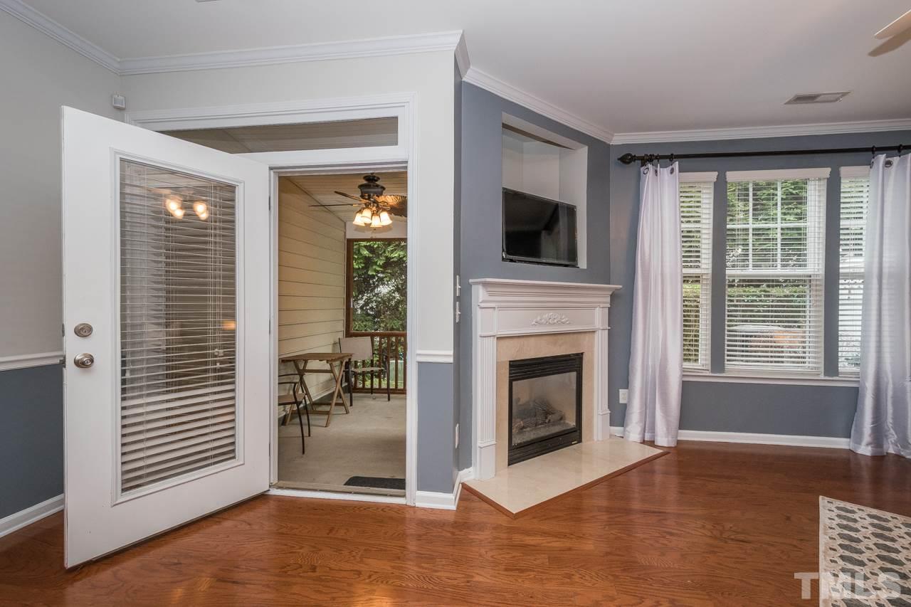 4924 Amber Clay Lane Raleigh, NC 27612 - Photo 12 of 24 a view of a livingroom with a fireplace and window