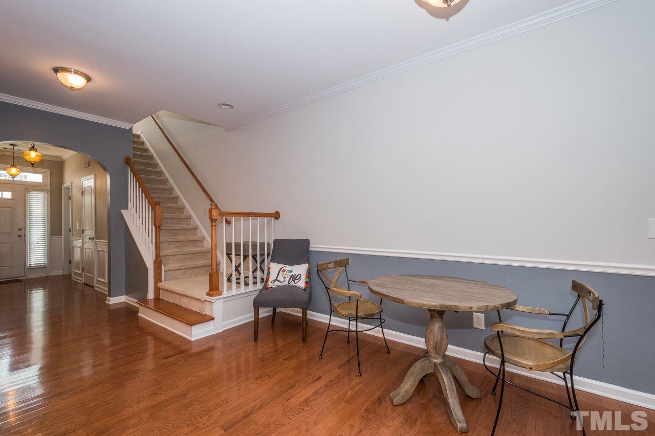 4924 Amber Clay Lane Raleigh, NC 27612 - Photo 15 of 24 a dining room with furniture and wooden floor