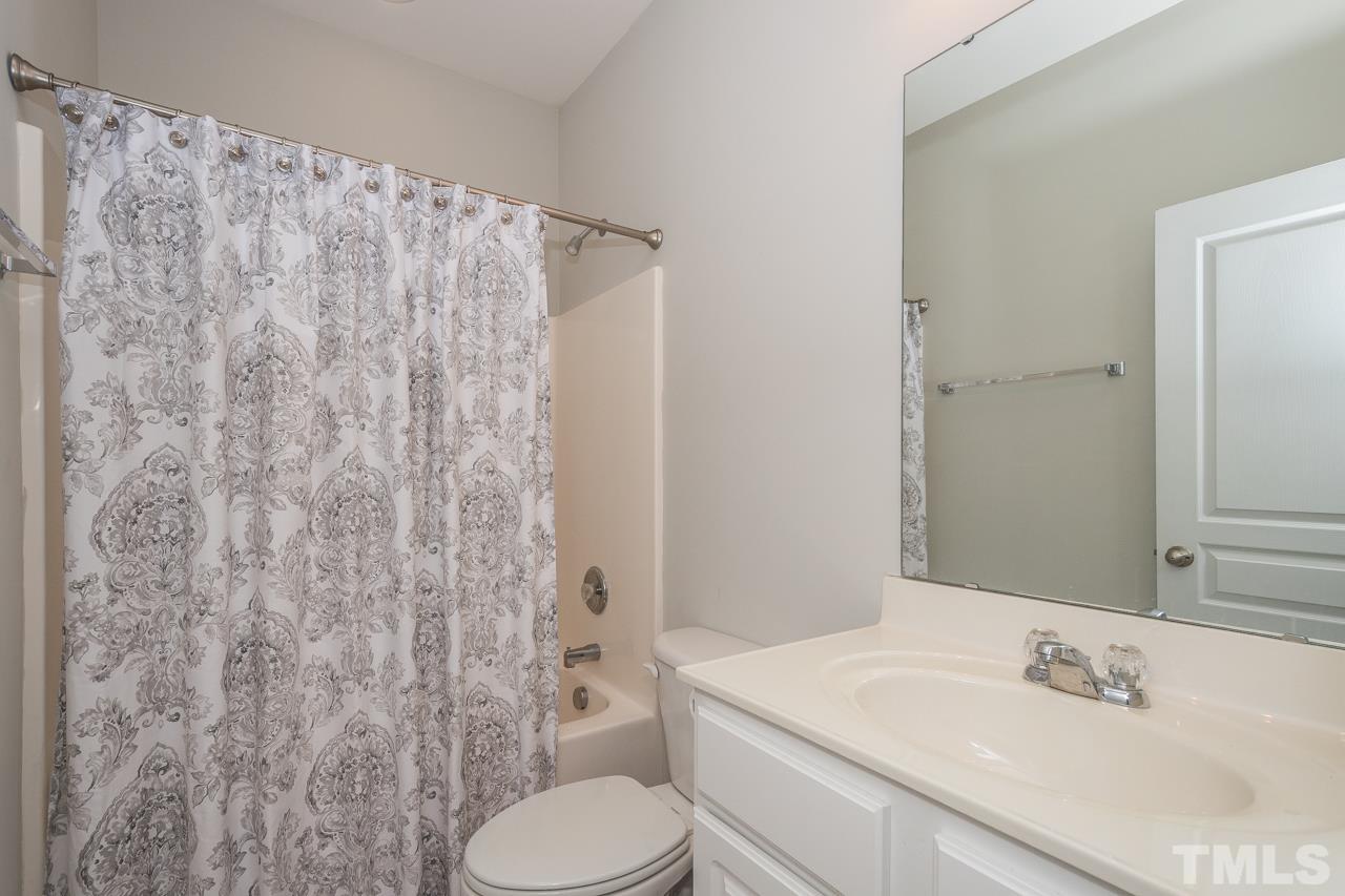 4924 Amber Clay Lane Raleigh, NC 27612 - Photo 22 of 24 a bathroom with a sink toilet and shower