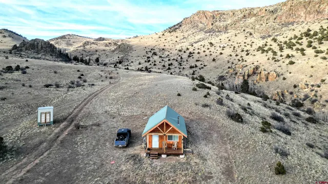 a aerial view of houses with outdoor space