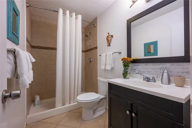 a dining room with furniture a chandelier and wooden floor