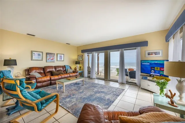 a kitchen with a sink stainless steel appliances and white cabinets