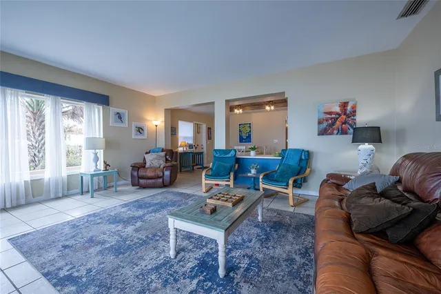 a bathroom with a toilet sink a mirror a vanity and shower