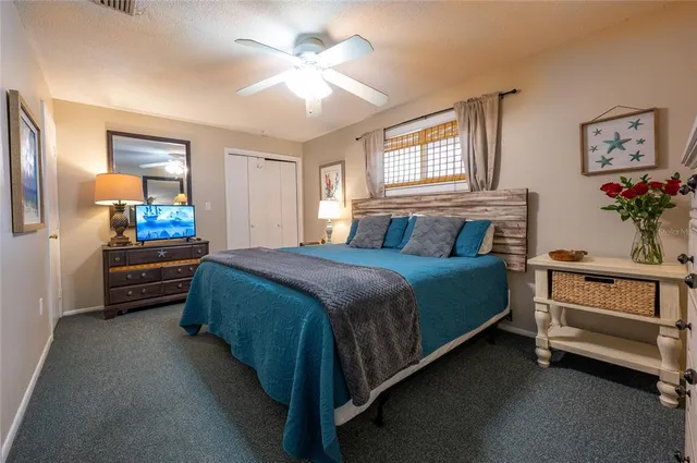 a bedroom with two beds and a chandelier