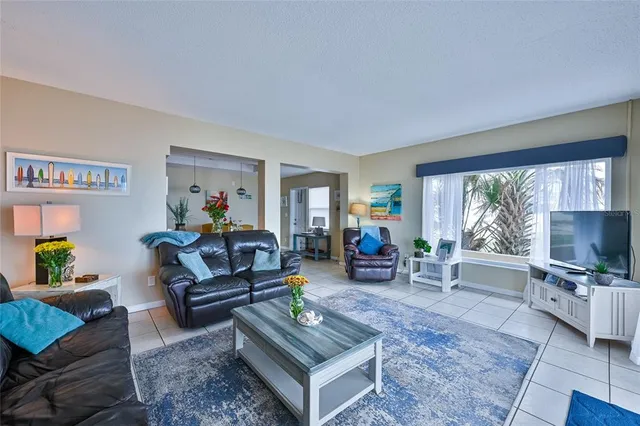 a bedroom with a bed and a potted plant