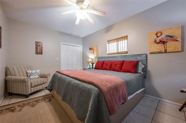 a kitchen with a sink a refrigerator and cabinets