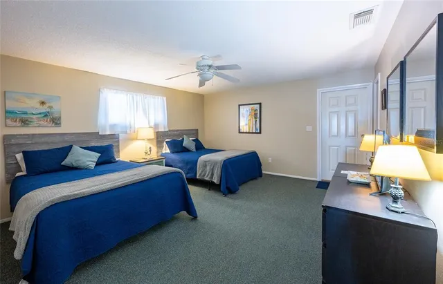 a bedroom with a bed and a dresser