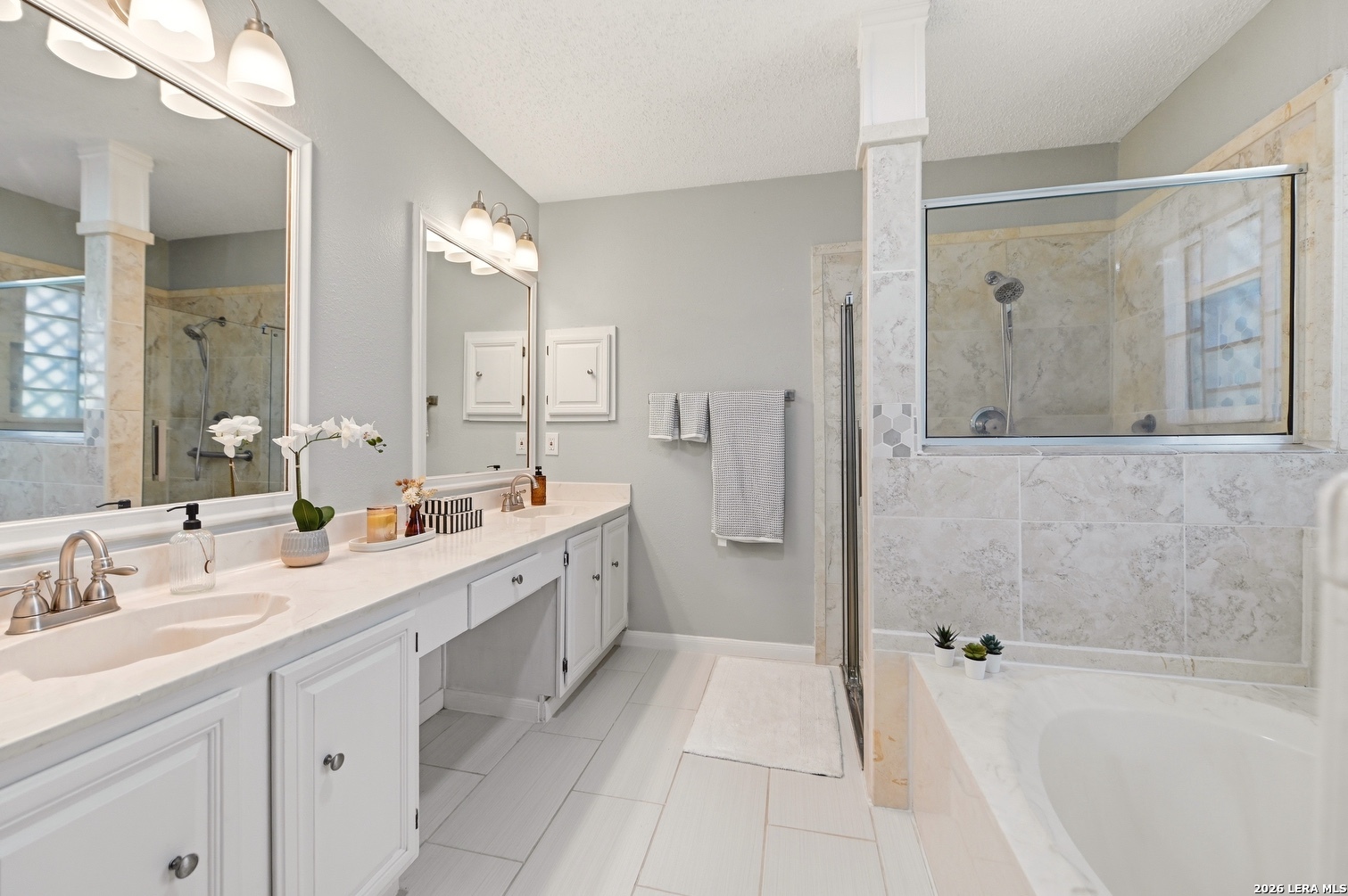 3820 Pheasant Schertz, TX 78108 - Photo 14 of 20 a spacious bathroom with a double vanity sink mirror double and bathtub