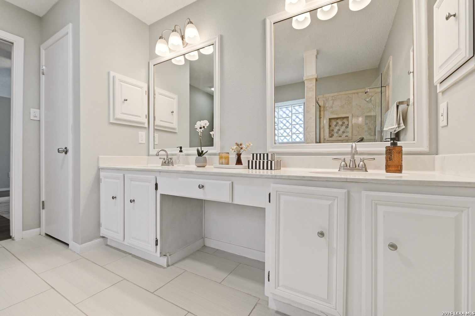 3820 Pheasant Schertz, TX 78108 - Photo 16 of 20 a bathroom with a sink double vanity and a mirror