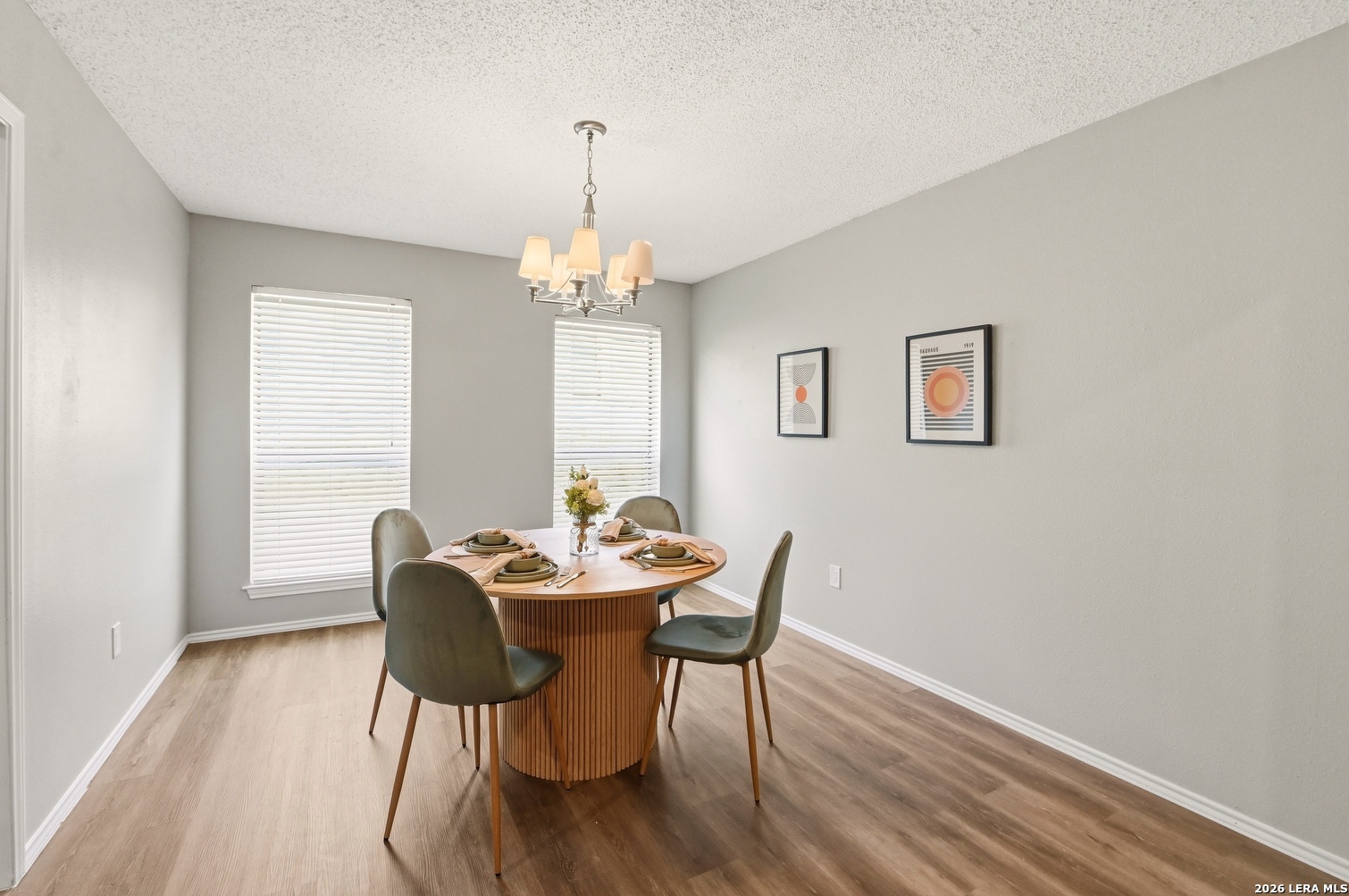 3820 Pheasant Schertz, TX 78108 - Photo 7 of 20 a view of a dining room with furniture and wooden floor