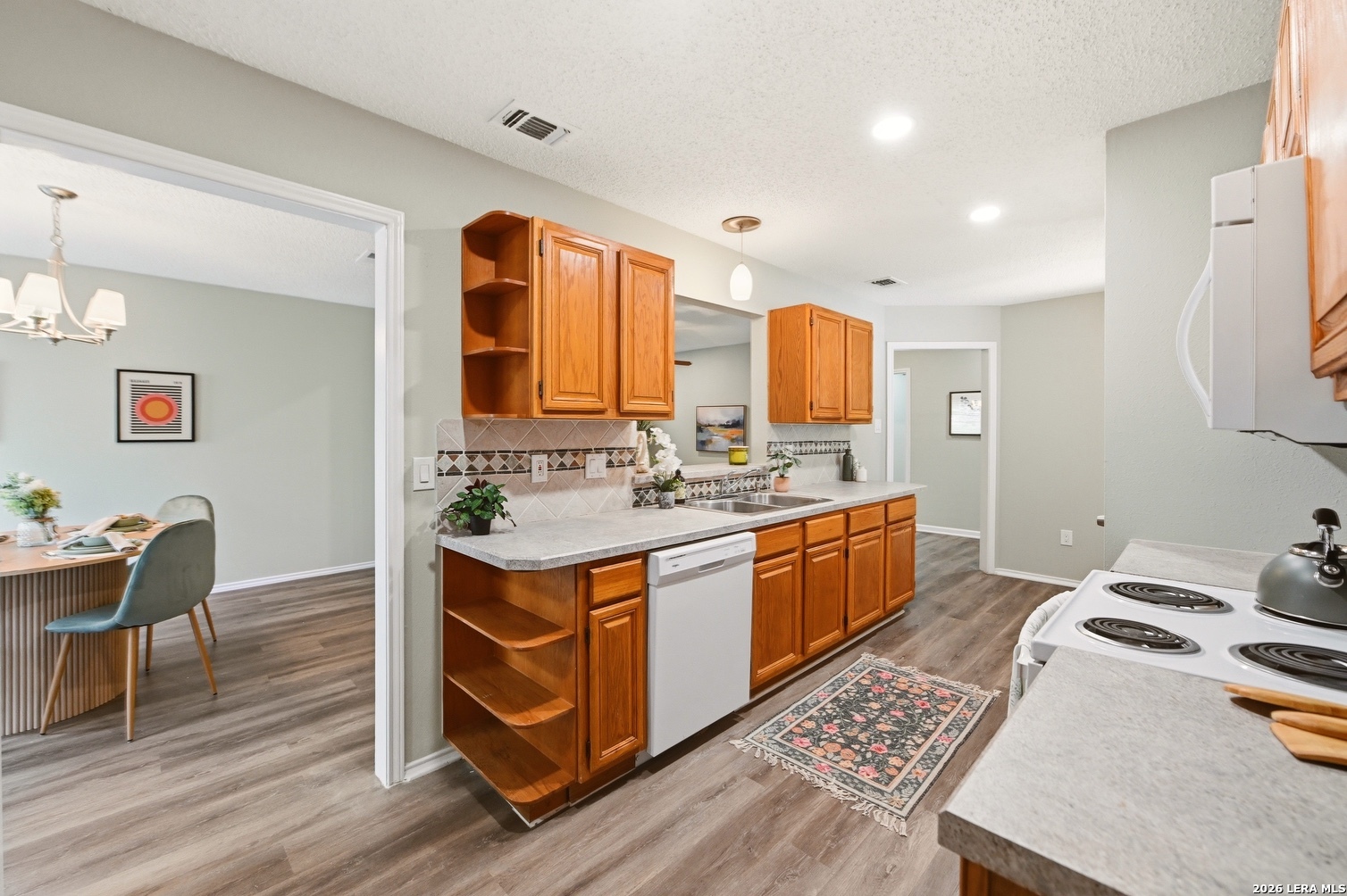 3820 Pheasant Schertz, TX 78108 - Photo 10 of 20 a kitchen with a sink appliances and cabinets