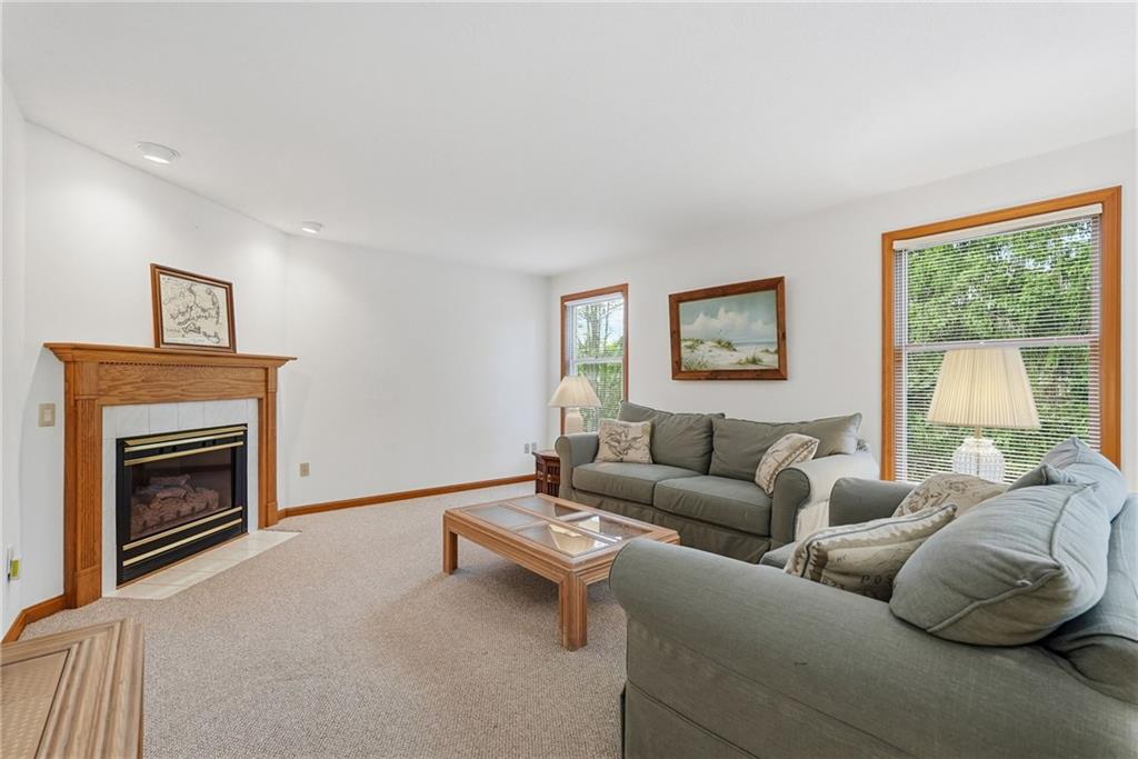 114 Sika Drive Pittsburgh, PA 15239 - Photo 19 of 45 a living room with furniture a window and a fireplace
