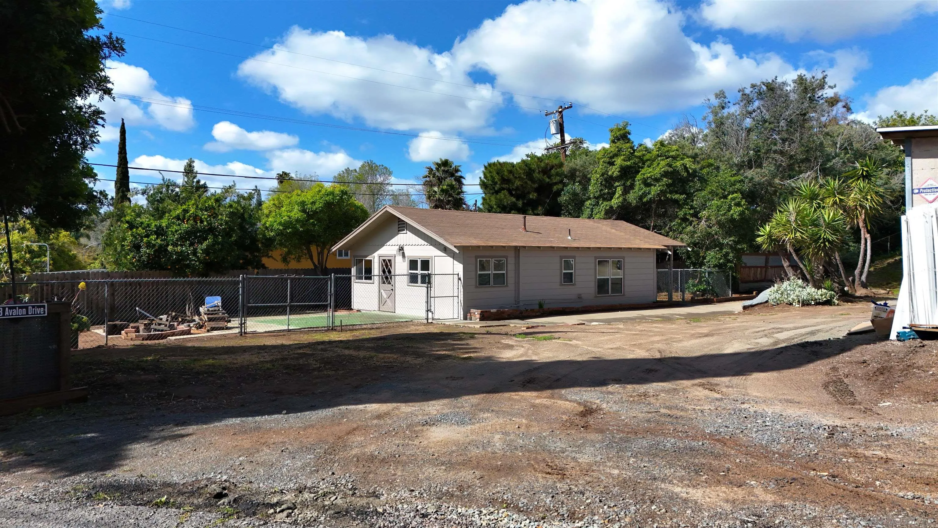 208 Avalon Drive Vista, CA 92084 - Photo 2 of 30 a front view of a house with a yard and trees