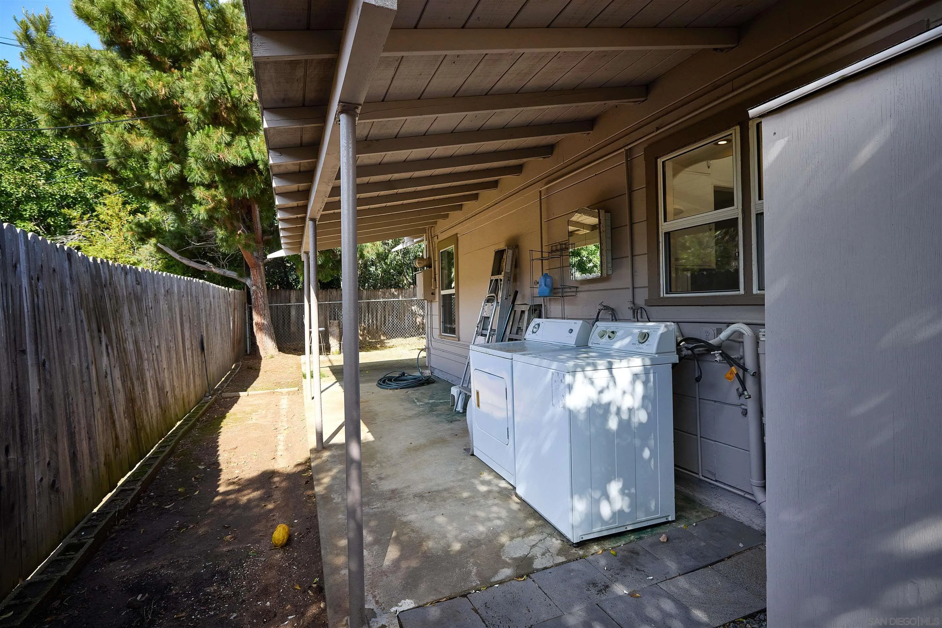 208 Avalon Drive Vista, CA 92084 - Photo 21 of 30 a view of a patio with table and chairs potted plants with wooden floor